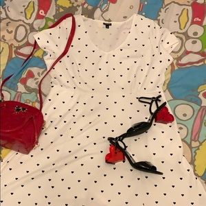 White dress with black hearts.